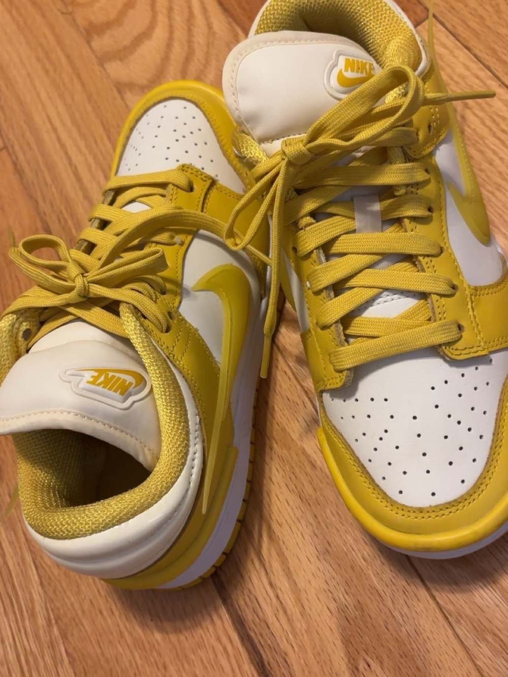 Nike Yellow and White Low-Top Sneakers with Bold Swoosh
